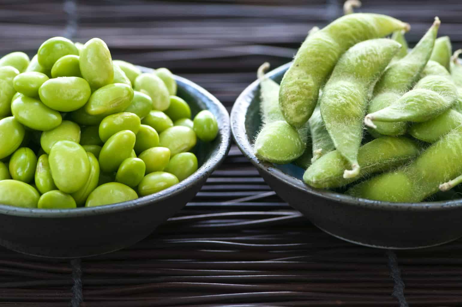 Edamame shelled and with pods in bowls