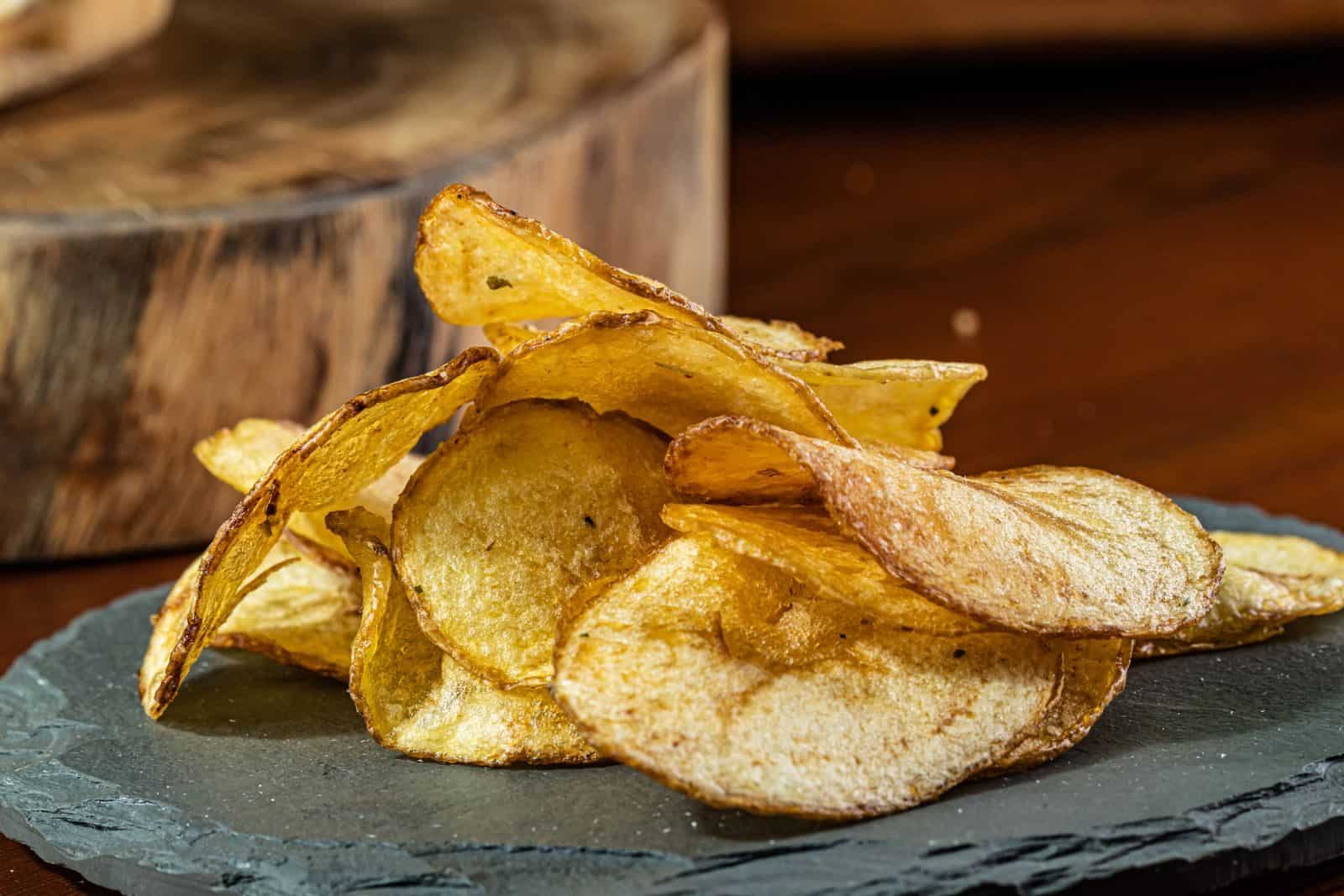 Avoid These Common Blunders When Choosing Your Next Hummingbird Feeder 9 Delicious homemade potato chips displayed on a rustic slate plate.